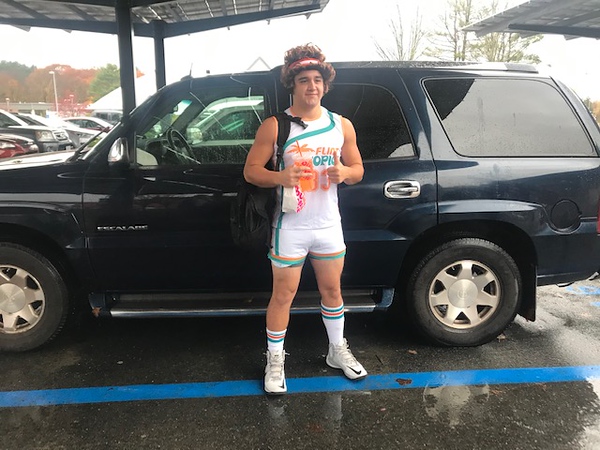 Senior Dante Parseghian dresses up as Jackie Moon from Semi-Pro, a basketball player played by Will Ferrell. Everything from the striped socks and the uncut hair, to the authentically too-short shorts, makes the costume immediately recognizable to many in the parking lot.