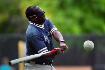 A player on the Boston Renegades beep baseball team takes a cut to make contact with the ball. “It feels good knowing that I can apply something that I know, which is baseball, because they are pretty similar, the swings are the same, and it feels good that I can help out people who really do need as many coaches as they can,” junior Josh Schreiber said. 

