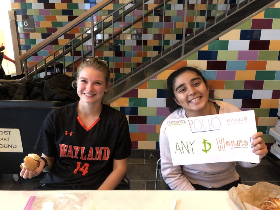 Seniors Rohini Ramesh and Molly ODriscoll run the fundraising table.