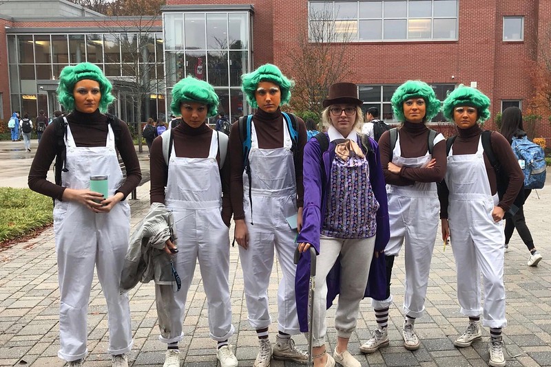 Seniors Izzy Van Rooyen, Ciara Murphy,  Adren Knapp, Maddie Olstein, Carly Camphausen, and Caroline Lampert pose together as Oompa Loompas and Charlie from Charlie and the Chocolate factory.