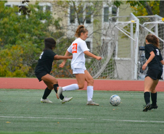 In her last game before her knee injury, Camphausen dribbles the ball down the field against Cambridge Rindge & Latin. Camphausen was able to pull away with a goal from a 4-0 win. "I’m just really happy about the timing because I did get to play half of my last soccer season and if I could go back to not play soccer and not have torn my ACL, I wouldn’t have done that because I just love soccer so much and I love the team,” Camphausen said.