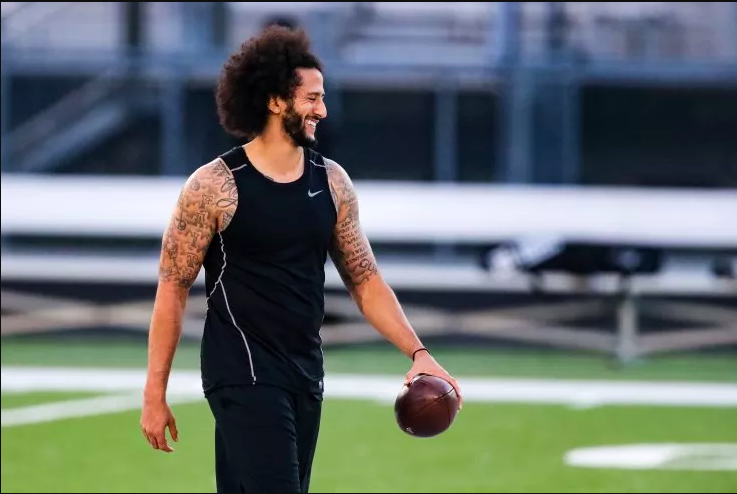 Former NFL quarterback Colin Kaepernick is seen smiling at an NFL workout in Atlanta on Nov. 16. WSPN's Jimmy Paugh offers his perspective on the suspicious workout arranged by the NFL.