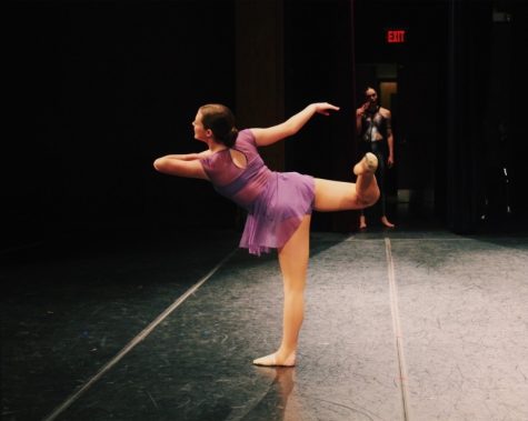 Peck bends her back leg into an attitude as she preforms her solo on the competition stage. “My favorite thing about competitive dance is that you get a lot of adrenaline in the moment because it’s so high pressure, but also really fun,” Peck said. Peck is dances with both Window Dance Ensemble and Broadway Bound Dance Center.