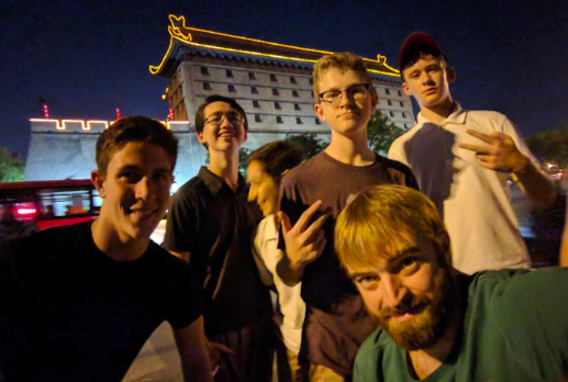 Sophomores Luciano Sebastianelli, Keita Wiliams, Devin Dicarlo, Andrew Boyer, Lucas Thompson, and WMS teacher Brian Reddington pose infront of a building in the city of Xian on the China trip. I learned a lot of life lessons, sophomore Devin Dicarlo, who went on the trip last year said. One, to always be outgoing and put a smile on somebody’s face.