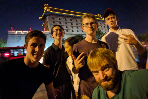 Sophomores Luciano Sebastianelli, Keita Wiliams, Devin Dicarlo, Andrew Boyer, Lucas Thompson, and WMS teacher Brian Reddington pose infront of a building in the city of Xi'an on the China trip. "I learned a lot of life lessons," sophomore Devin Dicarlo, who went on the trip last year said. "One, to always be outgoing and put a smile on somebody’s face."