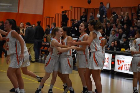 The girls varsity basketball team celebrates after its first playoff game win against Hopkinton. The team fell in their quarterfinal game last Thursday against Medfield. WSPN reviews and previews the seasons of the team along with other winter sports.