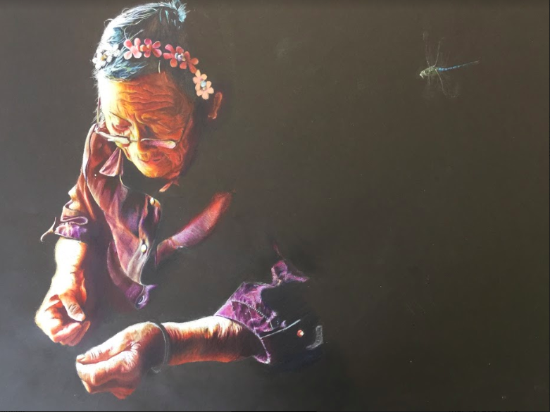 Sophomore Lily Yu creates a drawing of an old woman. Yu won a National Gold Medal from Scholastic for this piece. “I think art is a lot like music because it makes up for the shortcomings that every language has, Yu said. “Sometimes, it is able to convey emotions that we cant express in words.