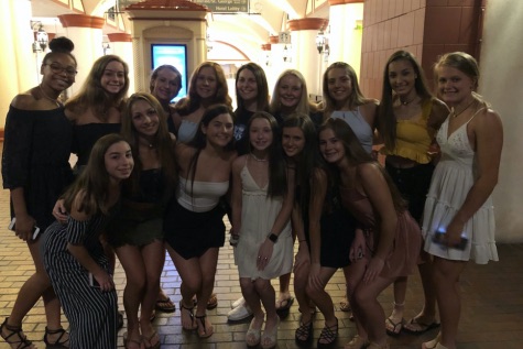 After team dinner, Rocket Cheer head coach Gina Cournoyer (middle of top row) surprises her athletes as they prepare to compete at the Superbowl of all-star cheerleading, the World Championship.