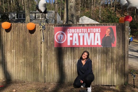 Senior Fatma Sayeh poses in front of her decorations, prior to her celebration.