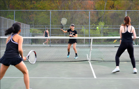Girls varsity tennis captain senior Mallory Leonard plays on the old courts that have since been replaced in construction. Leonard and her teammates have not been able to play on the new courts due to cancellations caused by COVID-19. “This season we were so excited to get to play on the new courts out front that we have been waiting for,” girls varsity tennis captain Emma Levy said. “It is sad to know I will never get to play a match on them.”