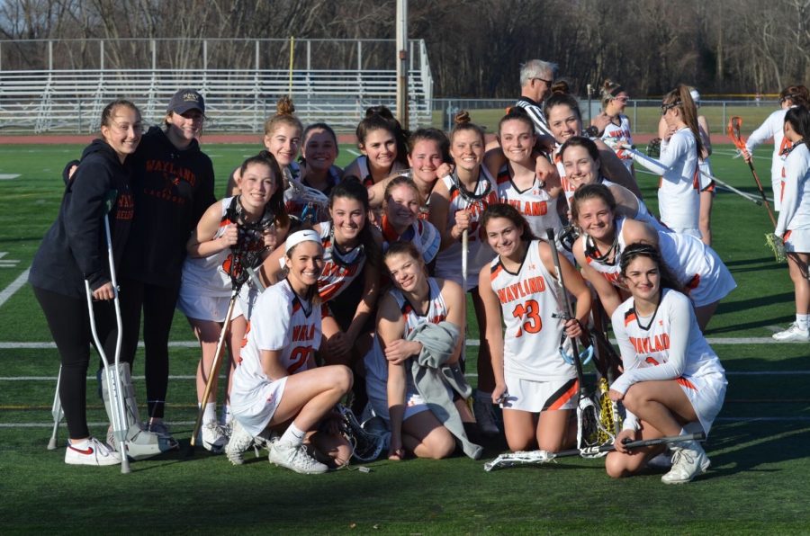 Members of the 2019 varsity girls lacrosse team get together after their game. This year, all spring senior athletes were denied their final spring season. “Volleyball is really the unfinished chapter of my high school athletic career,” said Davies. “It’s just sad that I will never get to leave the impression that I would have liked to in volleyball.”
