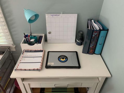 Junior Haley Melvin shows her workspace she has created in the comfort of her home. Having a designated area to do work is extremely important in these times of online learning.