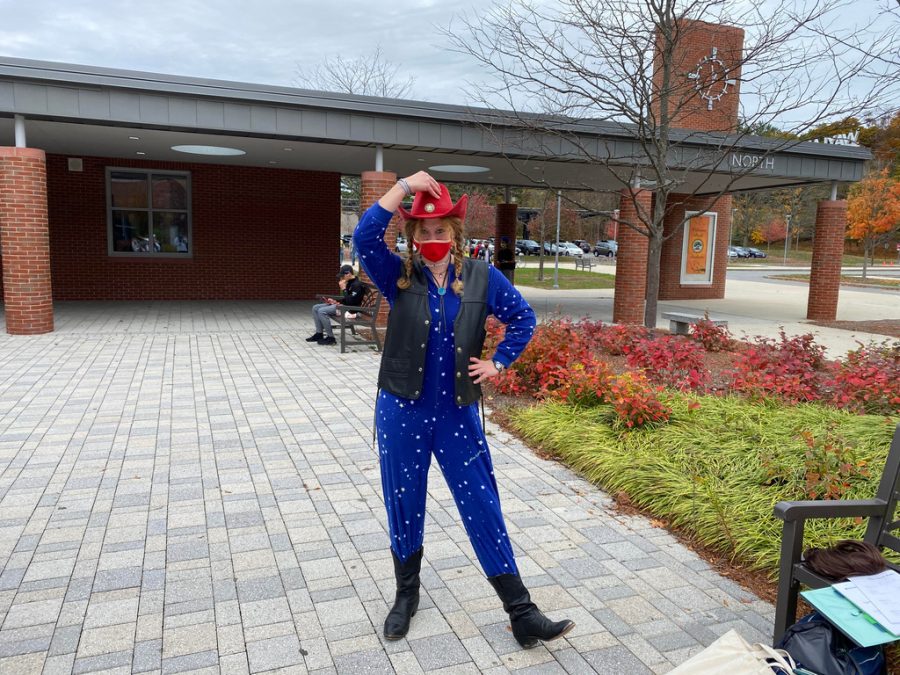 Senior Charlotte Salitsky puts her hands on her hips as a Space Cowboy. Salitsky got creative and chose to wear a onesie to keep her warm during the chilly day.