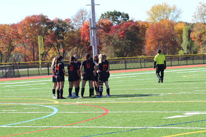 The WHS girls varsity soccer team huddles up at the start of the fourth quarter against Bedford. With strong teams like Bedford, the team has faced some tough competition throughout their season