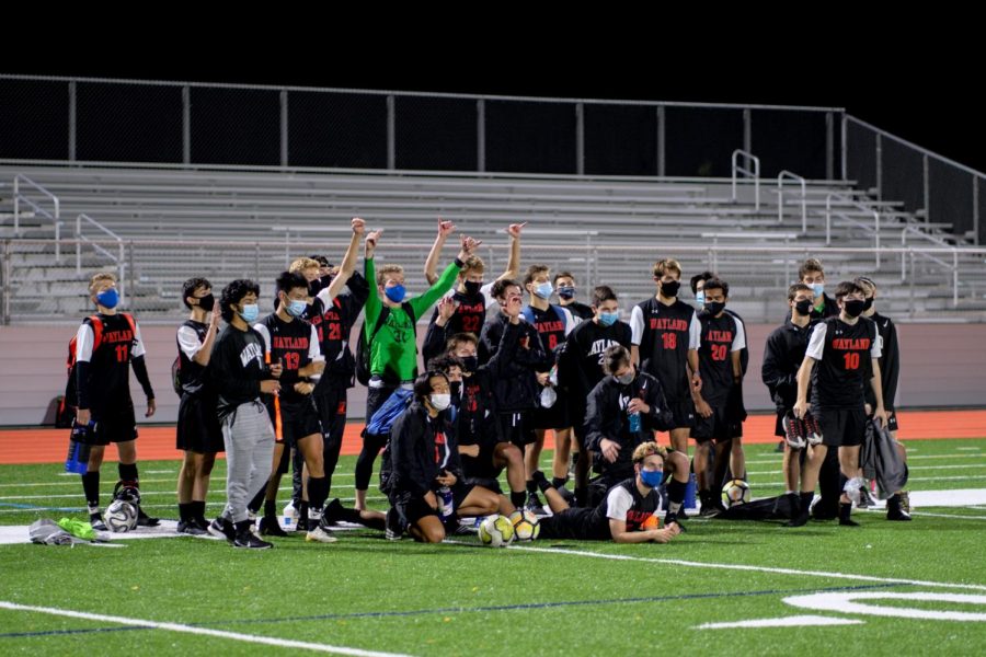 The+Wayland+boys+varsity+soccer+team+poses+after+the+first+game+of+their+season.+This+fall%2C+the+team+will+not+be+playing+in+a+state+tournament+as+it+was+cancelled+due+to+COVID-19.+Of+course%2C+it+is+strange+not+having+a+state+tournament+%5Bmy%5D+senior+year%2C+senior+boys+varsity+soccer+captain+Nick+Urato+said.+We+just+have+to+adapt+our+thinking+and+focus+on+one+game+at+a+time.