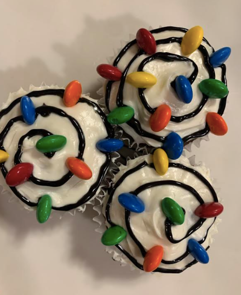 Step 7: For the finishing touch, add colorful M&Ms along the black string. Finally, sit back and enjoy this festive dessert!