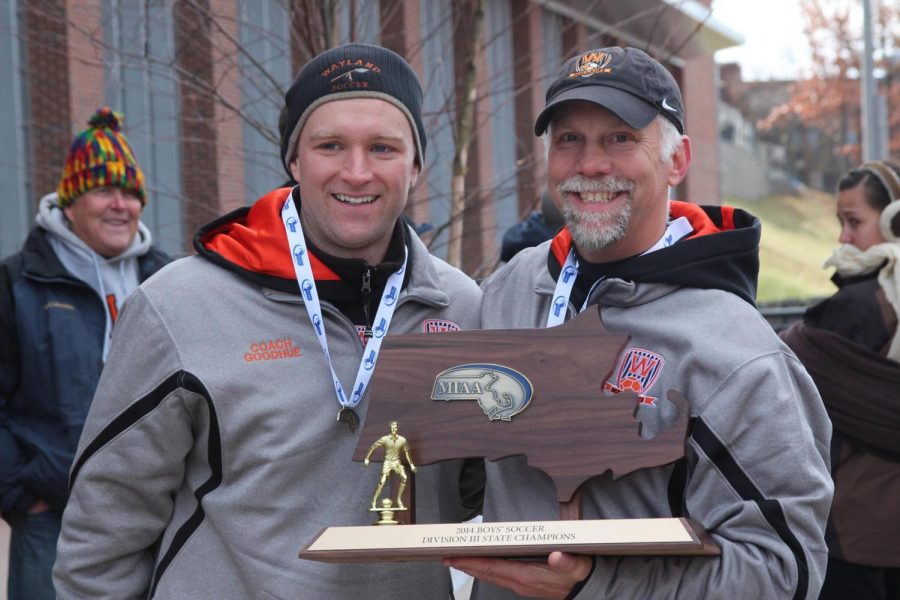 Head coach of the Wayland varsity boys soccer team, David Gavron, holds the 2014 state championship trophy, alongside assistant coach Charles Goodhue. Gavron has been the head of the boys soccer program since 2008, and the program has won 3 state titles under his leadership. “Im really glad that all of our coaches, we get to work together,” Gavron said. “Just because you might have a title next to your name, it doesn’t really mean anything in our program. It’s all about what we can do to make the boys experience better and make our program stronger.