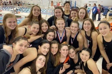 The Wayland High School girls swim team gathers together after a big meet. This year, winter sports teams will not have the opportunity to participate in highly anticipated meets such as the state tournament, but players have been trying to stay as positive and motivated as possible. “Its sad that we’re not going to get [a state tournament] this year, but at the same time we do have DCL’s so we’re just all grateful and something’s better than nothing,” sophomore swimmer Riley Kendall said.