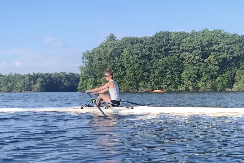 Senior+varsity+rower+Darcy+Foreman+rows+in+a+single+on+Lake+Cochituate.+Foreman+will+be+continuing+her+athletic+and+academic+career+rowing+Division+I+next+year+at+the+University+of+Massachusetts+Amherst.+%E2%80%9CI+cant+wait+for+another+four+years+of+rowing+with+a+team+that+feels+more+like+family+and+to+be+able+to+enjoy+four+more+years+of+the+excitement+of+competing+and+the+beauty+of+being+on+the+water%2C%E2%80%9D+Foreman+said.