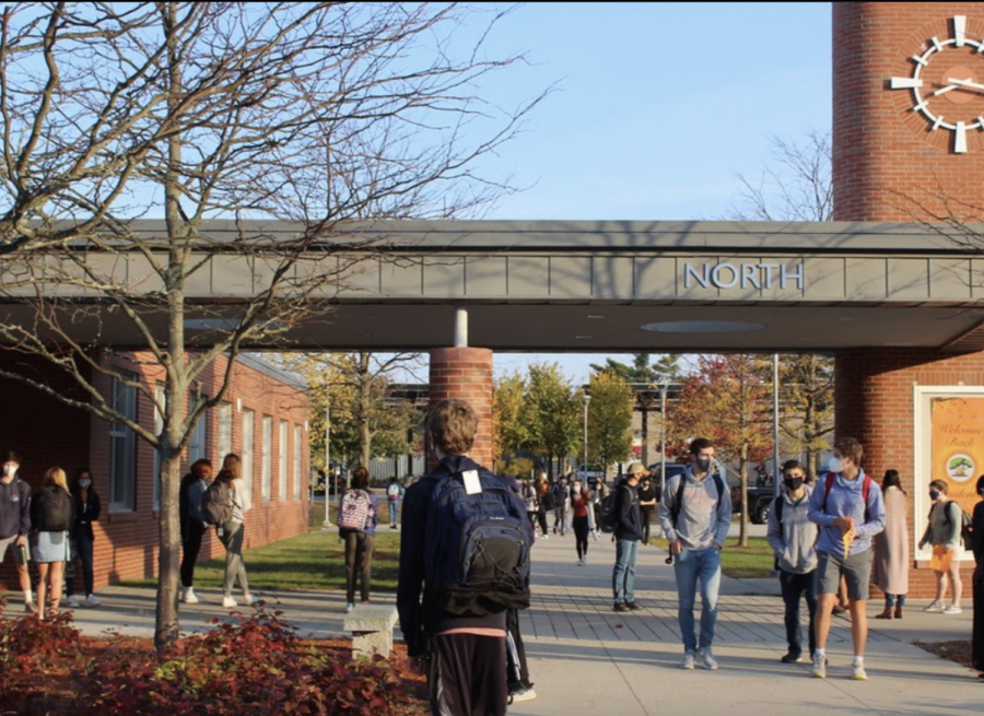 Students walk around the high school campus. During the school committee meetings on March 3 and 10, Assistant Superintendent Parry Graham gave a presentation on student, parent and teacher feedback in addition to grade data for both the high school and middle school hybrid model. 