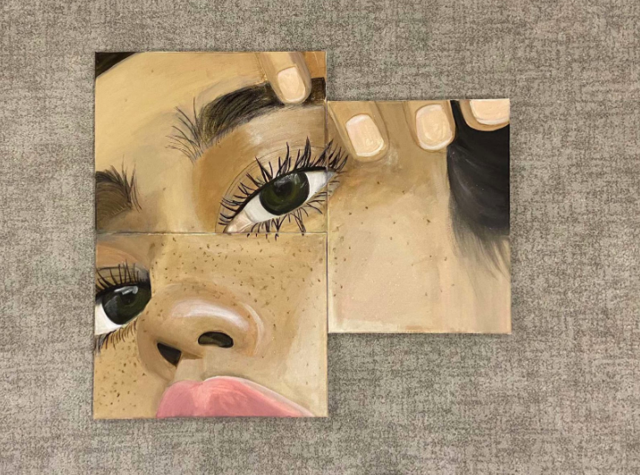 This three-canvas painting pictured is original painting by junior Sophie Ellenbogen. The final piece came after 10 hours of tedious work, but was spread out over the course of a few days. Ellenbogen wanted to practice working on more detailed pieces, so she decided to paint a close-up of a girl’s face. “This is one of my favorite pieces because of all the detail and different parts to it. It was hard to keep the canvases all lined up but I’m very happy with the results,” Ellenbogen said.