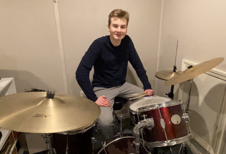 Junior Japhy Theobald prepares for his weekly private lesson by practicing by himself. Unlike many other musicians, Theobald doesnt use sheet music when he practices the drums. I feel like the lack of sheet music allows for more expression, Theobald said. Its all just rhythm, and at the core of every piece is rhythm.