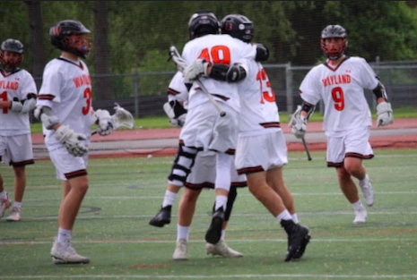 Boys lacrosse players celebrate together on the field. The MIAA recently approved a state tournament for spring sports. Im looking forward to winning the state championship, senior boys lacrosse player Dylan DeRubeis said. I think that with enough effort and hard work, we can win it all this year.