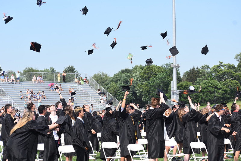 After the ceremony concludes, the Class of 2021 throws their caps in the air in celebration of graduating from Wayland High School.