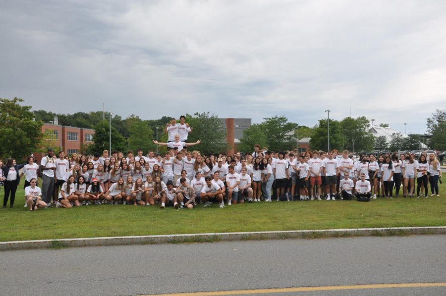 Wayland High School seniors gather outside on the first day of school for a class picture. In the upcoming year, many members of the class of 2022 will face the stressful college application process, in addition to spending one last year with their grade. “I’m looking forward to the last year with our grade,” senior Sidney O’Rourke said. “Obviously I hope things are somewhat normal just because the last two years have not been at all. I’m looking forward to just senior events, hopefully, they’ll be fun, even with Covid.”