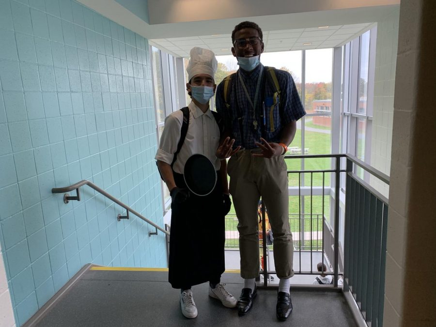 Seniors Daniel Bede and Alfonso Alvarez pose together at the top of the staircase. Bede dressed up as a nerd and Alvarez dressed up as a chef.