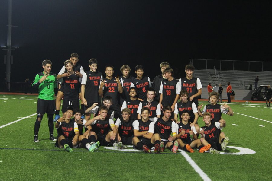Players get together and pose for their victory picture. The game finished 2-1 Wayland, with goals scored by senior Alfonso Alvarez and junior Luke Caples.