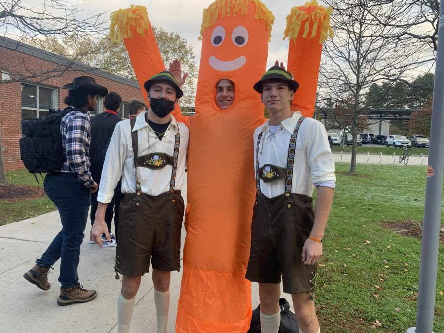 Seniors Sean Goodfellow, Ryan MacDonald and Finn ODriscoll come together in their lederhosen and inflatable man costumes they got at Party City and Spirit Halloween. Oktoberfest inspired [our] costumes, ODriscoll said.