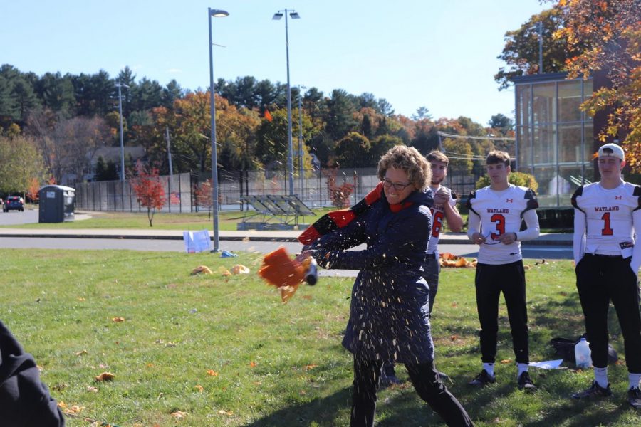 Connect teacher Erin Lehmann participated in the fun by hitting a few pumpkins with a baseball bat. Lehmann helped the Connect class students plan the event.