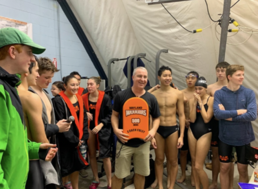 Wayland+High+Schools+varsity+swim+team+stands+together+after+the+announcement+of+the+boys+team%E2%80%99s+state+and+sectional+meet+win+in+Feb.+2020.+Since+then%2C+WHSs+swimming+and+diving+teams+have+not+competed+in-person+at+a+state+or+sectional+meet+due+to+the+pandemic%2C+and+they+participated+in+virtual+events+throughout+the+last+season.+%E2%80%9CWe+feel+confident+that+we%E2%80%99ll+have+them+ready+regardless+of+what+the+state+tells+us+to+do+or+when+we+can+do+it%2C%E2%80%9D+swim+and+dive+coach+Michael+Foley+said.+%E2%80%9CWe%E2%80%99re+going+to+be+prepared.%E2%80%9D