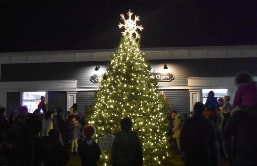 Children stand and watch Waylands annual Christmas tree lighting, the final event of the towns Holiday Stroll. The Holiday Stroll took place on Saturday, Dec. 11 as a way of spreading holiday cheer amongst Wayland residents after over a year in quarantine.