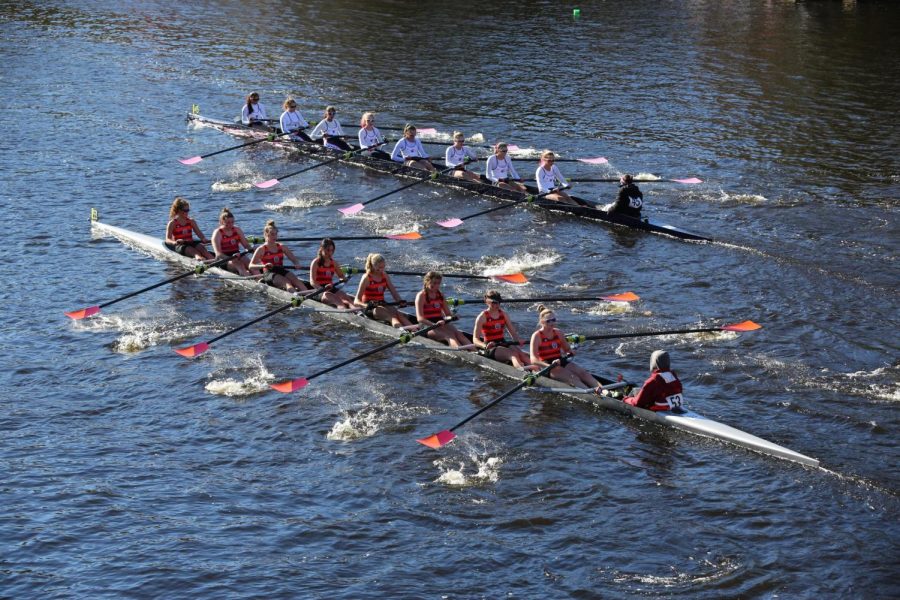 The Wayland-Weston crew team rows at the Head Of The Charles. From the left of the front boat to the right: sophomore Maddie Genis, junior Riley Kendall, junior Megan ODonell, junior Sophia Xie, sophomore Ava Balukonis, Weston sophomore Natalia Serov, Weston sophomore Siena Flanigan, senior Quinn Gleason and sophomore Max Markarian.
