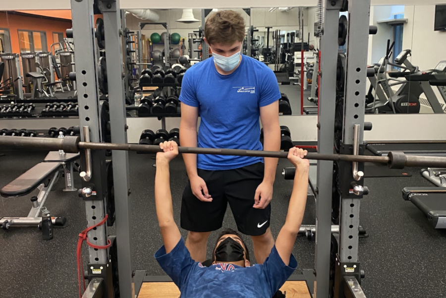 Club leader Ethan Brandeleone and member Aditya Weling work out in the weight room. My biggest accomplishment was getting some of my friends into weightlifting, Harris said. It was hard to get them started, but once they did they really got at it. 