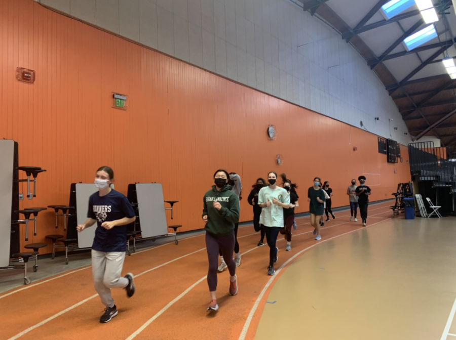 Wayland High Schools Indoor track members prepare for their next meet. Practices include circuit runs, distance running, and focus on specialized events. Wearing face masks is very important and necessary at practices as the COVID-19 numbers continue to grow. 