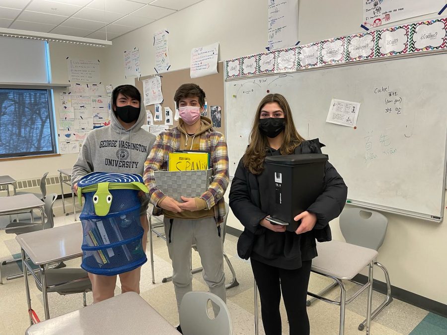 Junior Johnny Andreasen, along with sophomores Graham Lieb and Vida Moradi show off their items that they are using for backpacks. The three classmates exhibit their school spirit by bringing anything but a backpack to school.