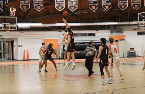 Senior Spencer Dines darts into the air, fighting to win the jump ball against Westford. This matchup marked the final Friday night home game for the warriors this year. We have got to be less selfish as a team and learn to play as a team, Dines said.