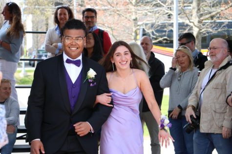 Senior Jojo Leshore brought friend and Wayland resident Kiki Ferreira to prom. They both beamed at the abundance of friends and family as they walked down the orange carpet.