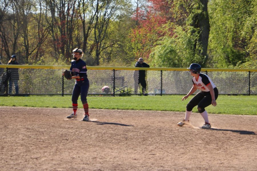 Freshman Annabelle Roberts takes a lead as they hesitate to run to the next base. Roberts plays as pitcher and first base, as well as being a stand-out hitter in this game against Lincoln-Sudbury.