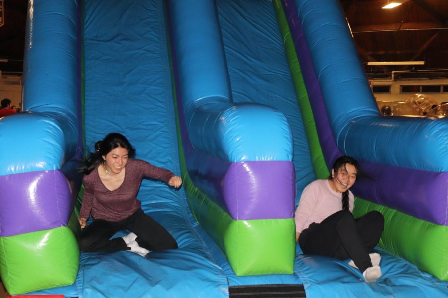 Seniors Isabelle Wang and Ashley Zhu raced down the slide, in hopes of beating each other.