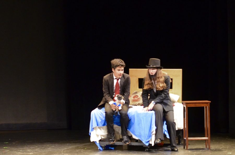 Sophomore Max Markarian playing a worried John F. Kennedy, gets a visit from freshman Rachel Goldstone, who plays the role of Abraham Lincoln, during “John F. Kennedy Zombie Slayer. This was Goldstones first play with WHSTE. “[Senior one acts] bring out people who might have been interested in performing but perhaps the commitment had been too big for the larger projects, so we sort of get a broader group coming out to perform,” drama teacher Aidan O’Hara said.