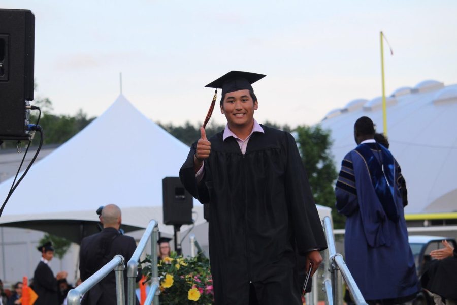 After shaking hands with Superintendent Omar Easy, class advisors and senior class president Andrew Zhao, students walk off the platform. Senior Alex Camacho seemed to be pumped, smiling throwing a thumb up.