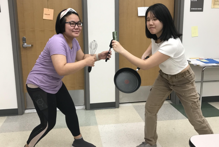 Juniors Eileen Kaewprasert (left, she/her) and Kaylee Mai (right, she/her) compete in Wayland High Schools Cooking Clubs end of the year cook off. It was exciting to go against one of my friends, but it was more fun to serve food Ive made myself to my friends,” Kaewprasert said.