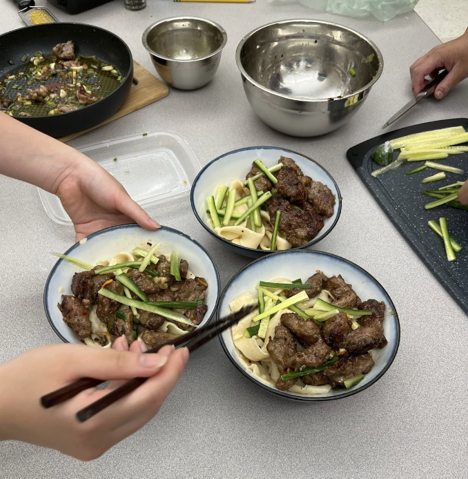 Kaylee Mai's dish consisted of lamb, flat noodles and cucumber. "It all smells so good," freshman Tristen Chow said. "Kaylee's cooking never fails to amaze me."