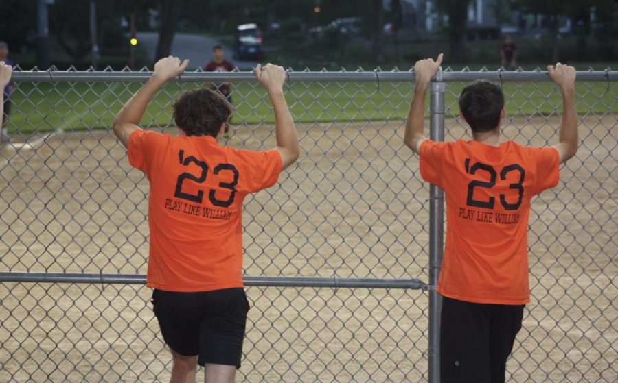 Class of 2023 WayCo players lean against the fence at the Cochituate fields watching their teammates play. This summer marked the 15th season of WayCo softball. Even since I’ve joined, I’ve seen the spectator turnout and social media presence grow a ton, 2020 WHS graduate Jack Brown said.