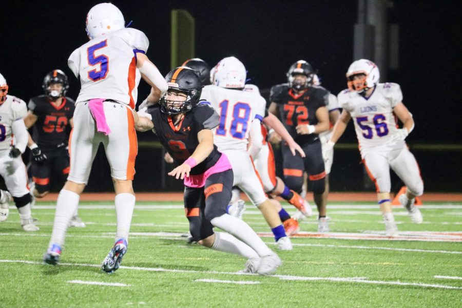 Sophomore Luke Dipetro-Froio defends the pass against the wide receiver. Despite losing, it was a good game for the seniors, potentially their last night at home, sophomore Ben Hynes said. Hopefully we can win a game this season.