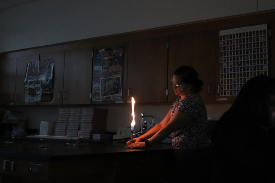 Mrs. Cowell, who teaches chemistry and forensics at WHS, tests her lab equipment while her class watches a film. Her forensics students were learning about the murders of Dawn Ashworth and Lynda Mann and how their cases were solved using DNA testing.